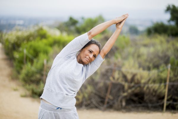 A beautiful African American Senior Woman Yoga Instructor demonstrates many poses